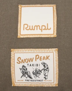 Snow Peak x Rumpl Nanoloft® Takibi Blanket in Pro Brown – Fire-Resistant Quilted Outdoor Blanket -Snow Peak Shop 20240718 19 Rumpl 00194 SnowPeakTakibi Logos HR UPDATED png
